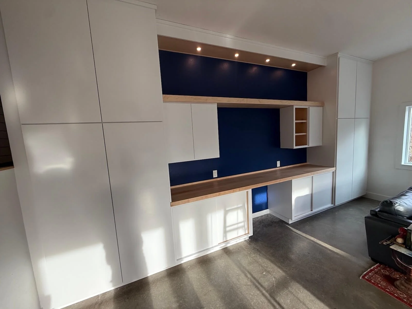 Built-in cabinets with lots of storage and shelving, with a solid maple countertop
