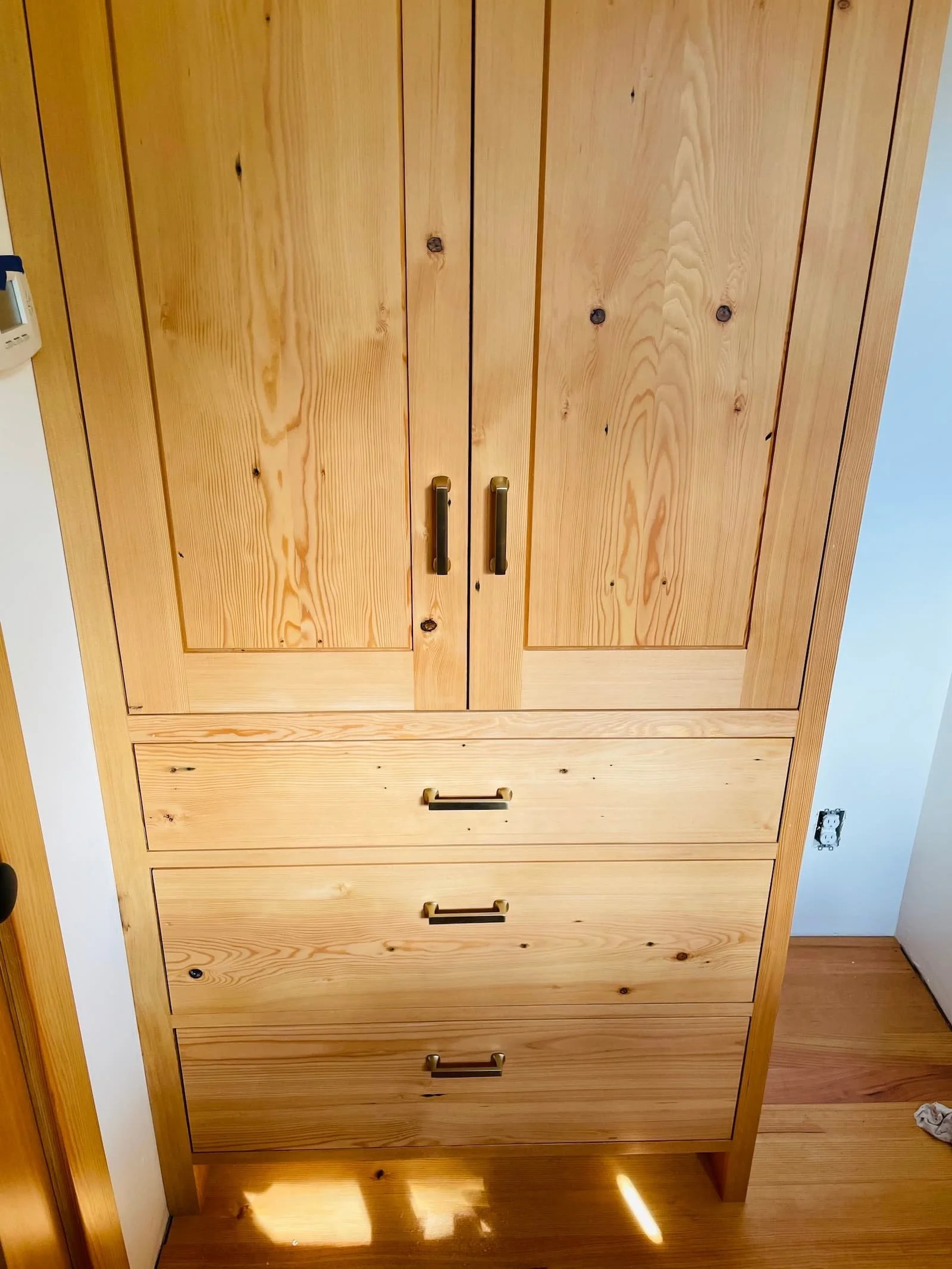 Fir armoire with drawers and slide out shelves