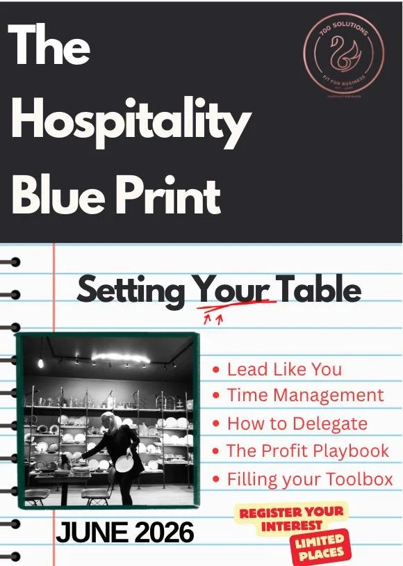 Cover of a hospitality management guide titled "The Hospitality Blue Print" with a subtitle "Setting Your Table" and a list of topics including leadership, time management, delegation, profit, and toolboxes, dated June 2026, with a black and white photo of a person setting a table in a kitchen.