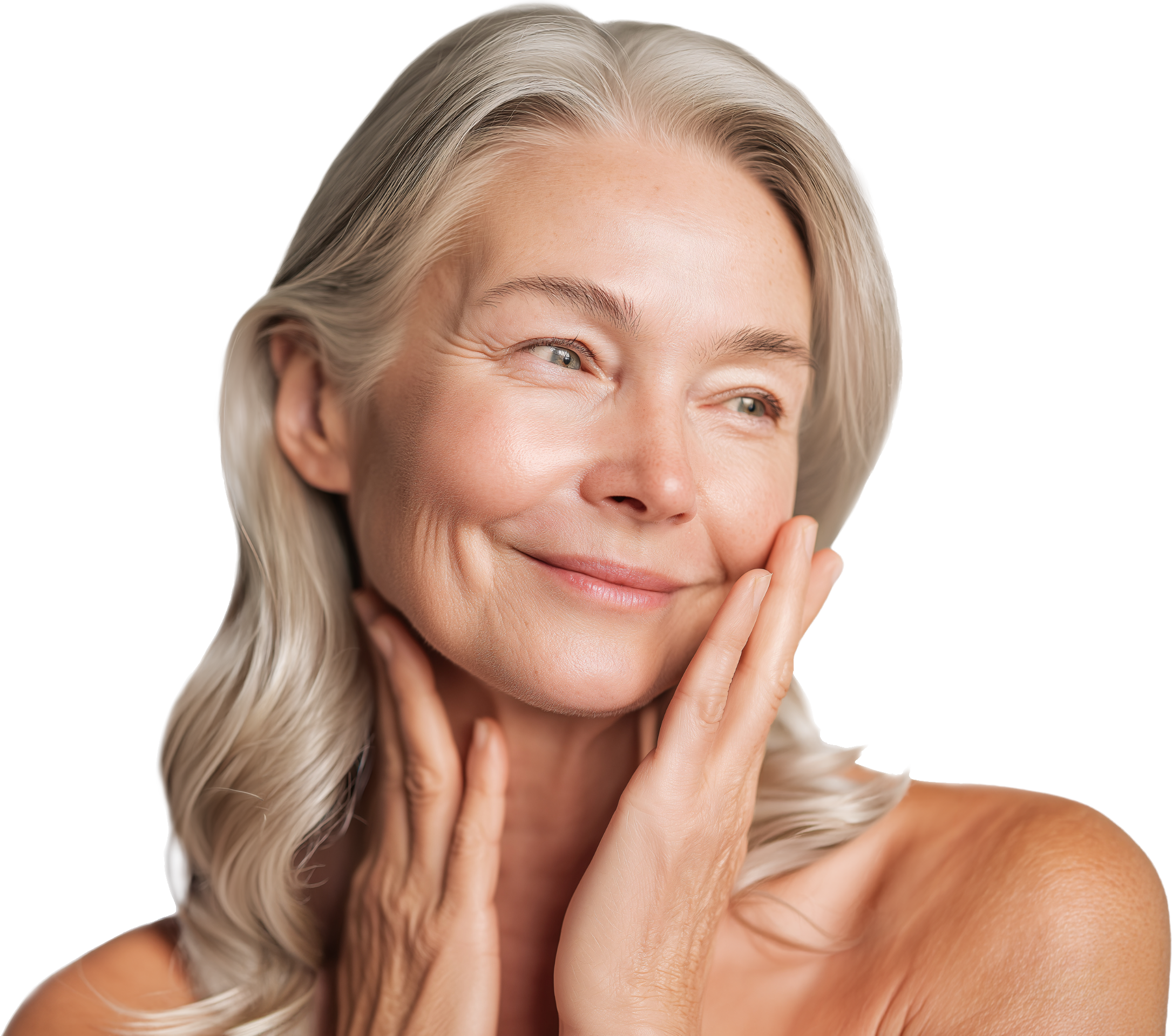An elderly woman with long gray hair softly smiling, touching her face and neck, exhibiting clear skin and a radiant expression.