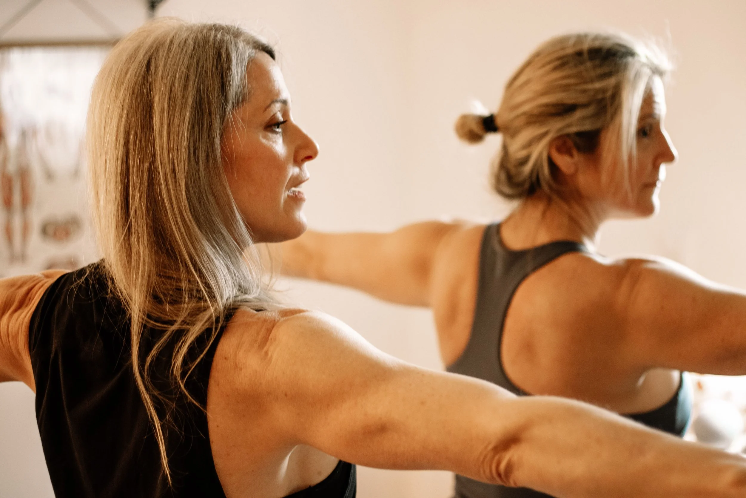 Yogi providing Private Yoga instruction.