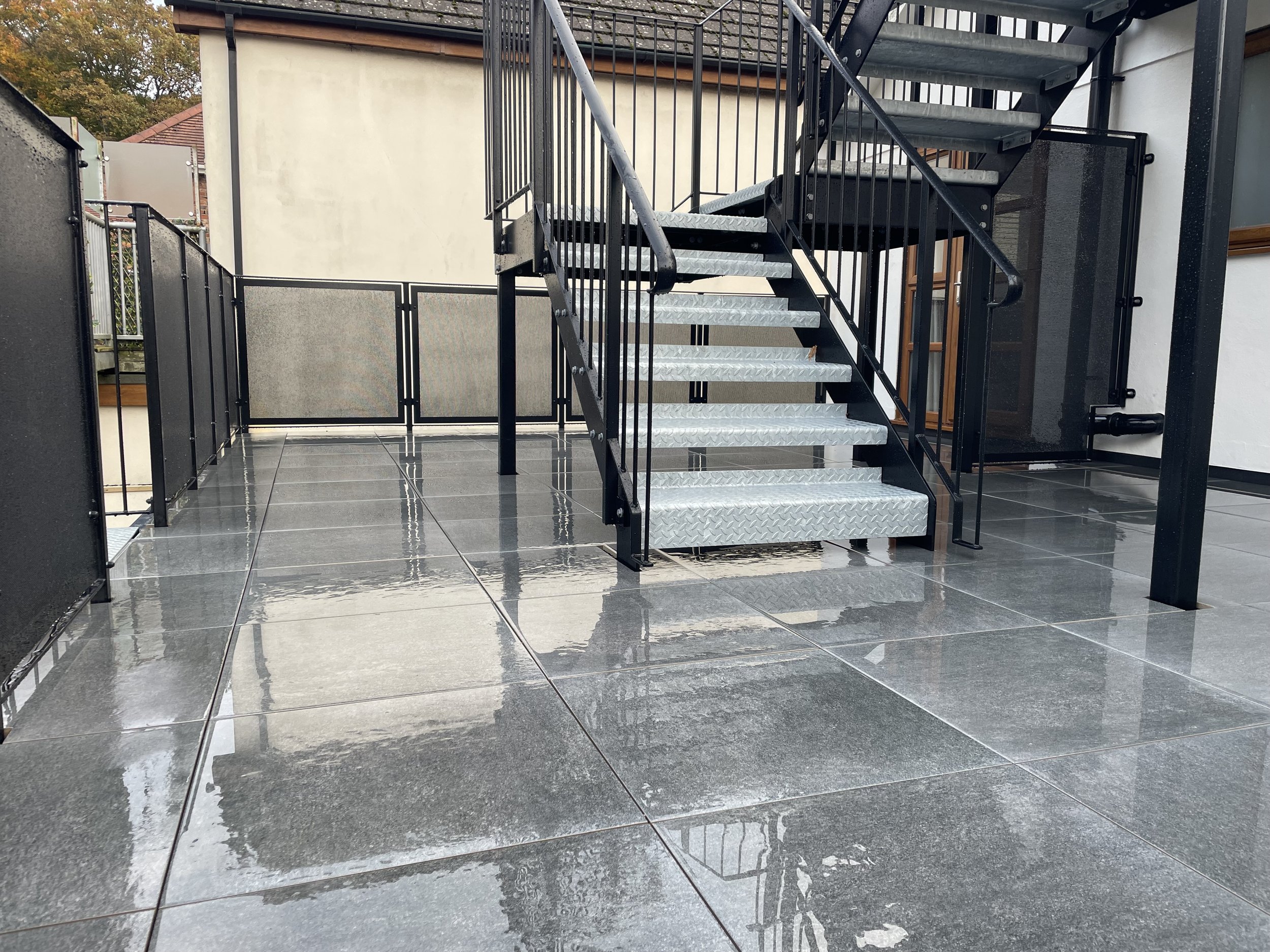 Image of porcelain tiled deck area laid on flat roof with raised pedestals