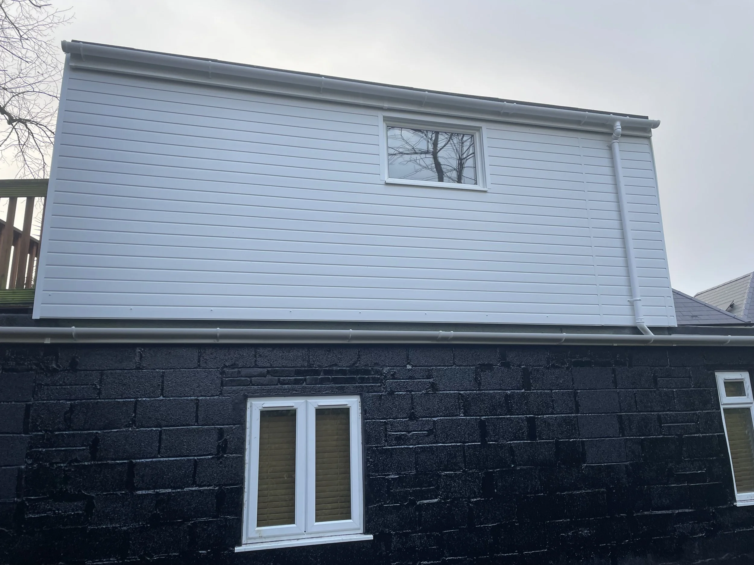 Plastic cladding and waterproofing to structure