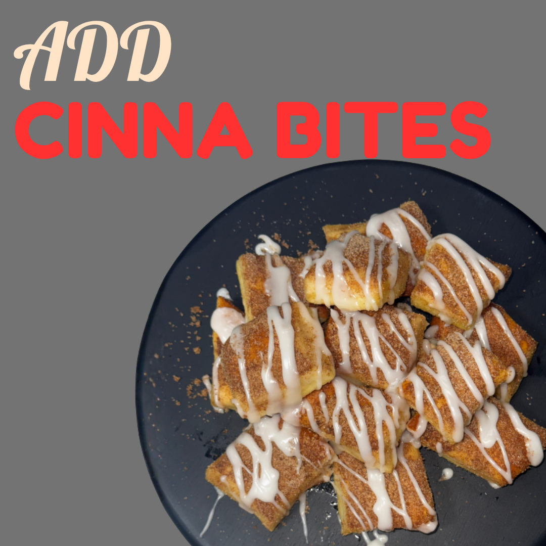 A plate of cinnamon toast squares drizzled with white icing and sprinkled with cinnamon sugar, on a dark plate against a gray background.