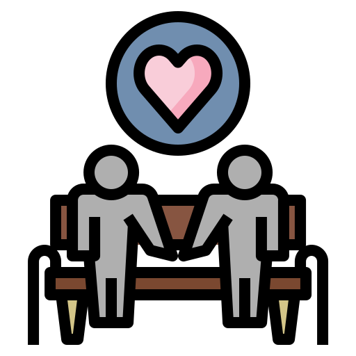 Deux personnes assises à une table, se tenant la main, avec un symbole de cœur en haut.