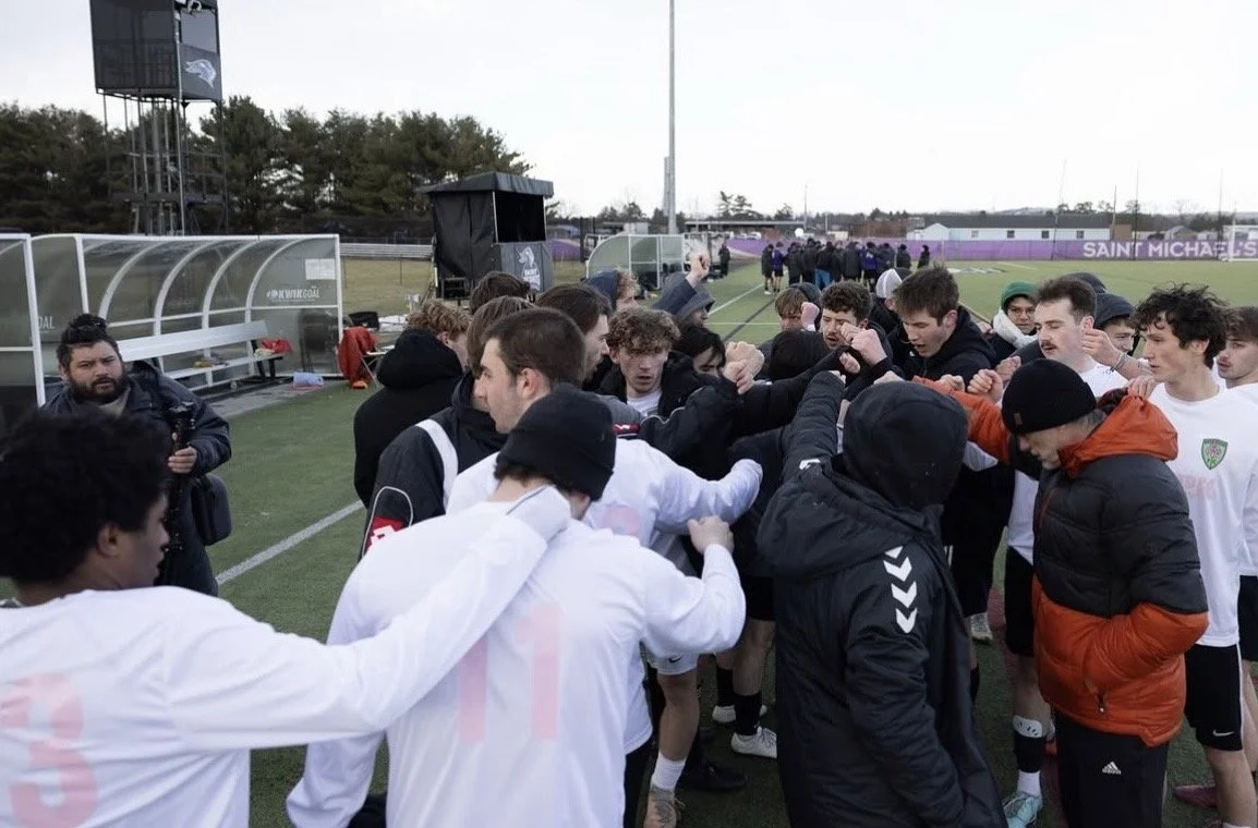Clover players huddle before their scrimmage against Saint Michales College