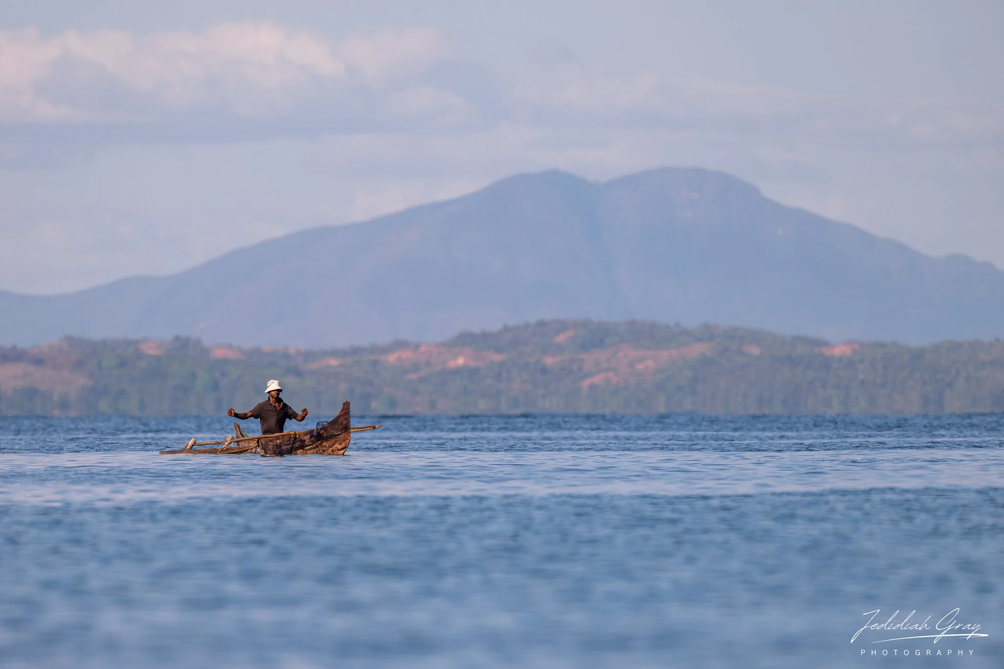 A fisherman fishing from his traditional pirogue