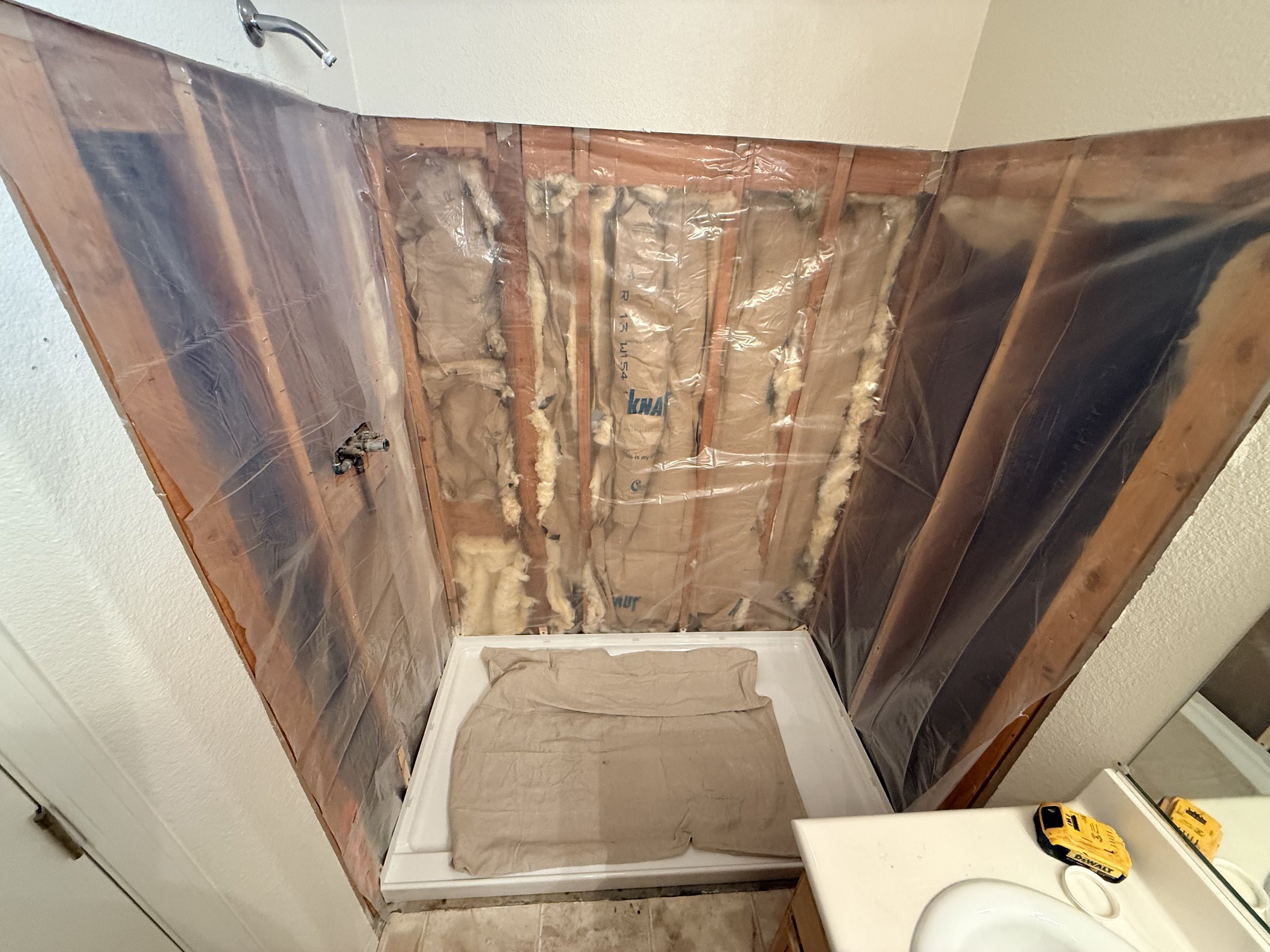 Shower Renovation 5 - New shower pan installed with a strong mortar base underneath the pan to give it strength so there will be no future cracking