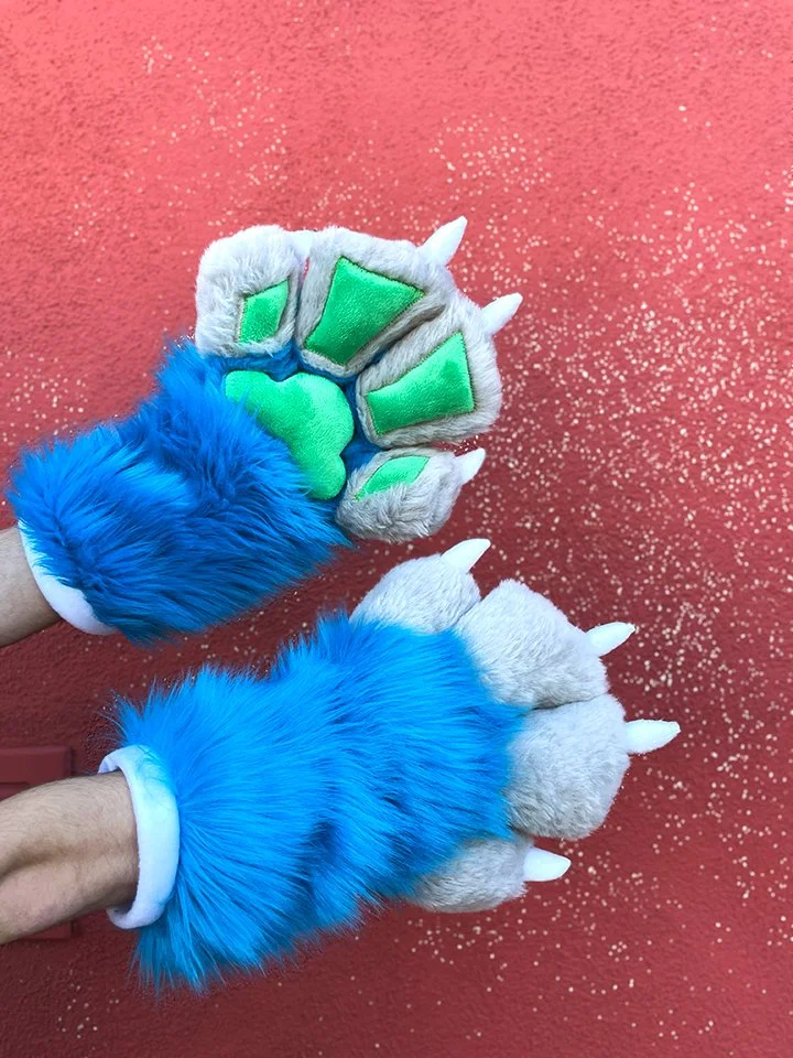 PAWS: 
Dragon character claws. 
(Materials used: Faux fur, minky fabric, fleece, stuffing, inside is lined with cotton fleece, hand stitching and sewing machine)
