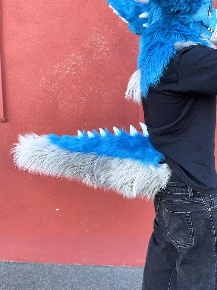 TAIL: The tail is made of foam and fur, with lined hidden hole for belt. Spikes made of fleece.
(Materials used: Faux fur, foam, hand stitching and use of sewing machine)