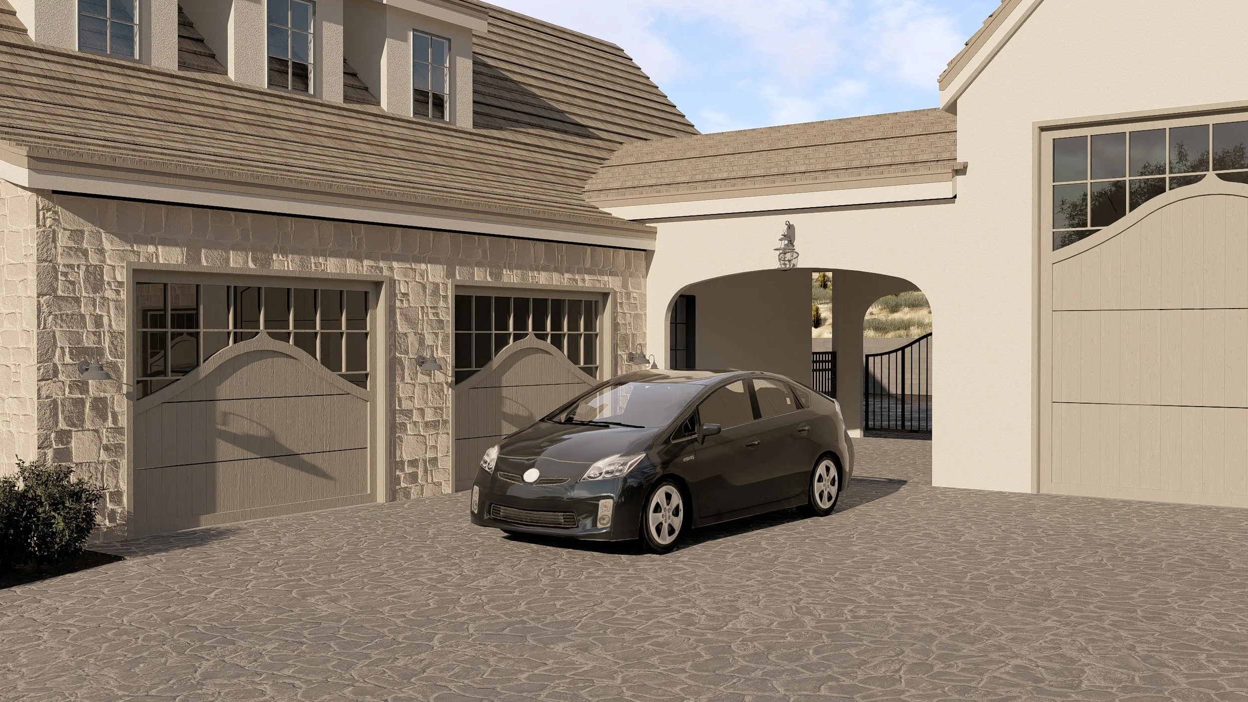 A black car parked in front of a beige stone and white stucco house with a cobblestone driveway, stone and wooden garage doors, and an arched gate.