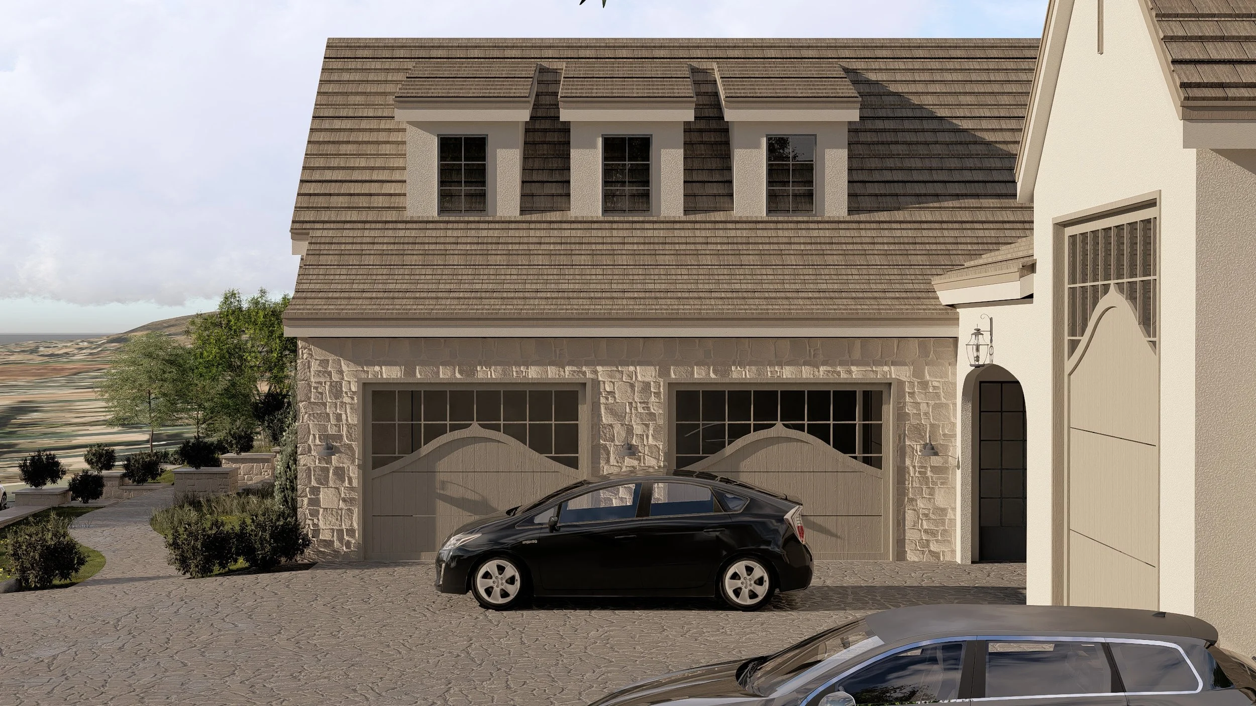 A modern house with a stone and white exterior, a garage with a black car parked in front, and a driveway made of stone pavers. There are windows on the upper floor, and outdoor lighting fixtures beside the garage doors and front door. Landscaping in
