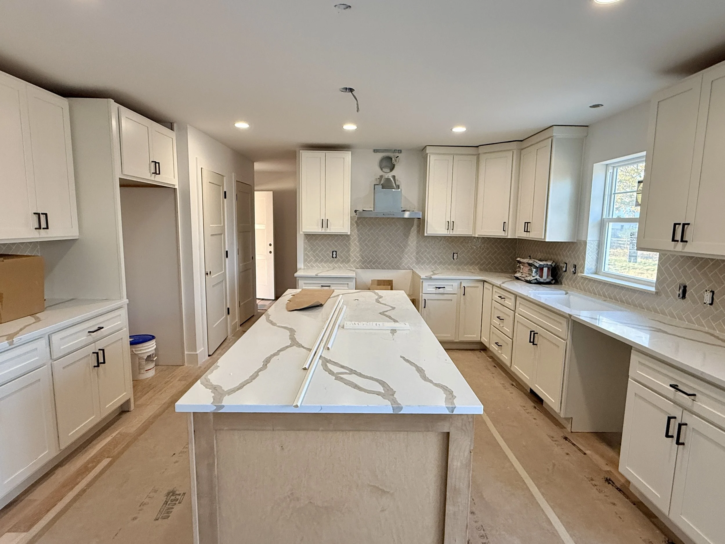 Kitchen under construction and messy before Blueprint Media services 