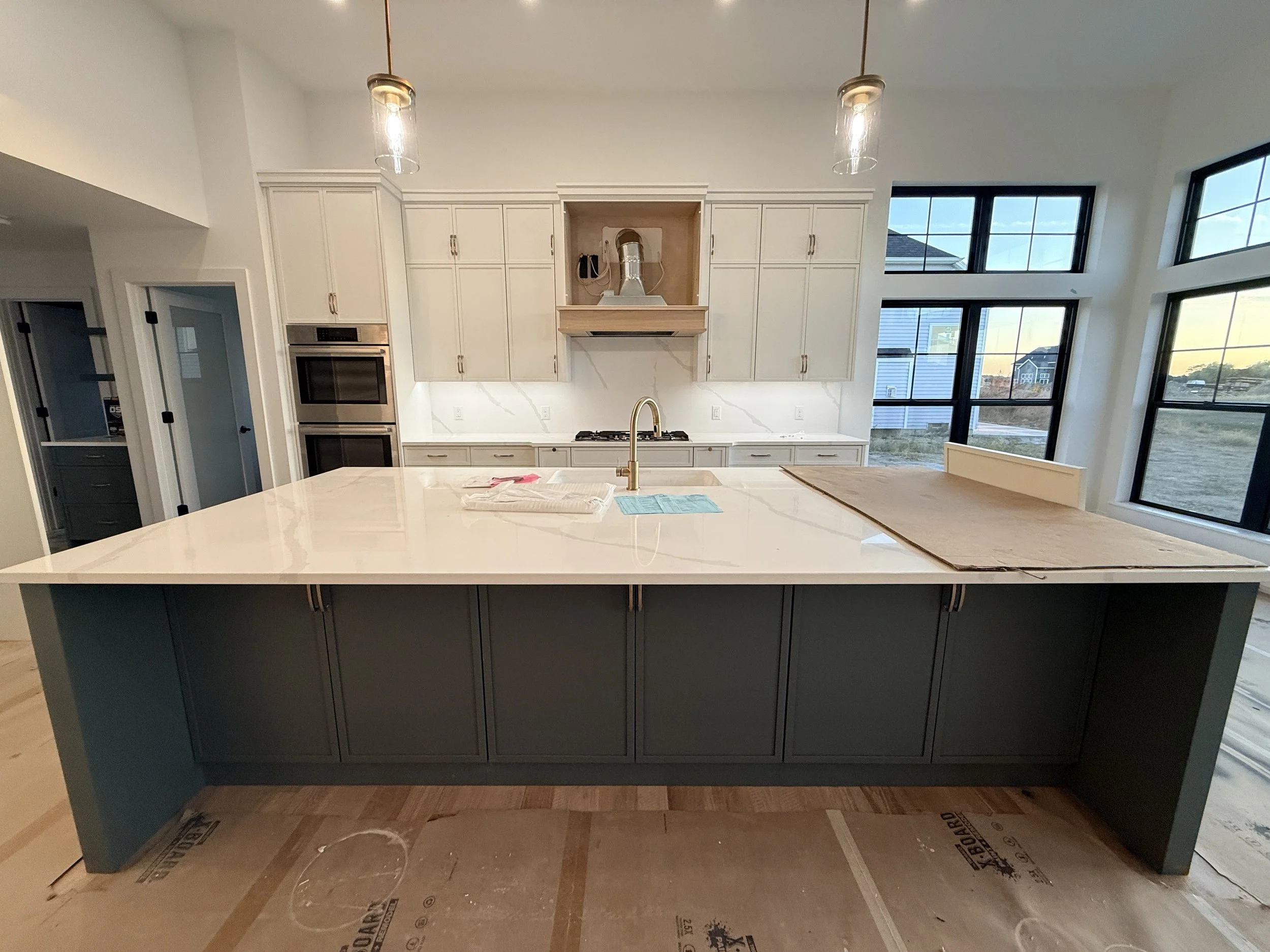 Before and after photo of under-construction home completed digitally.