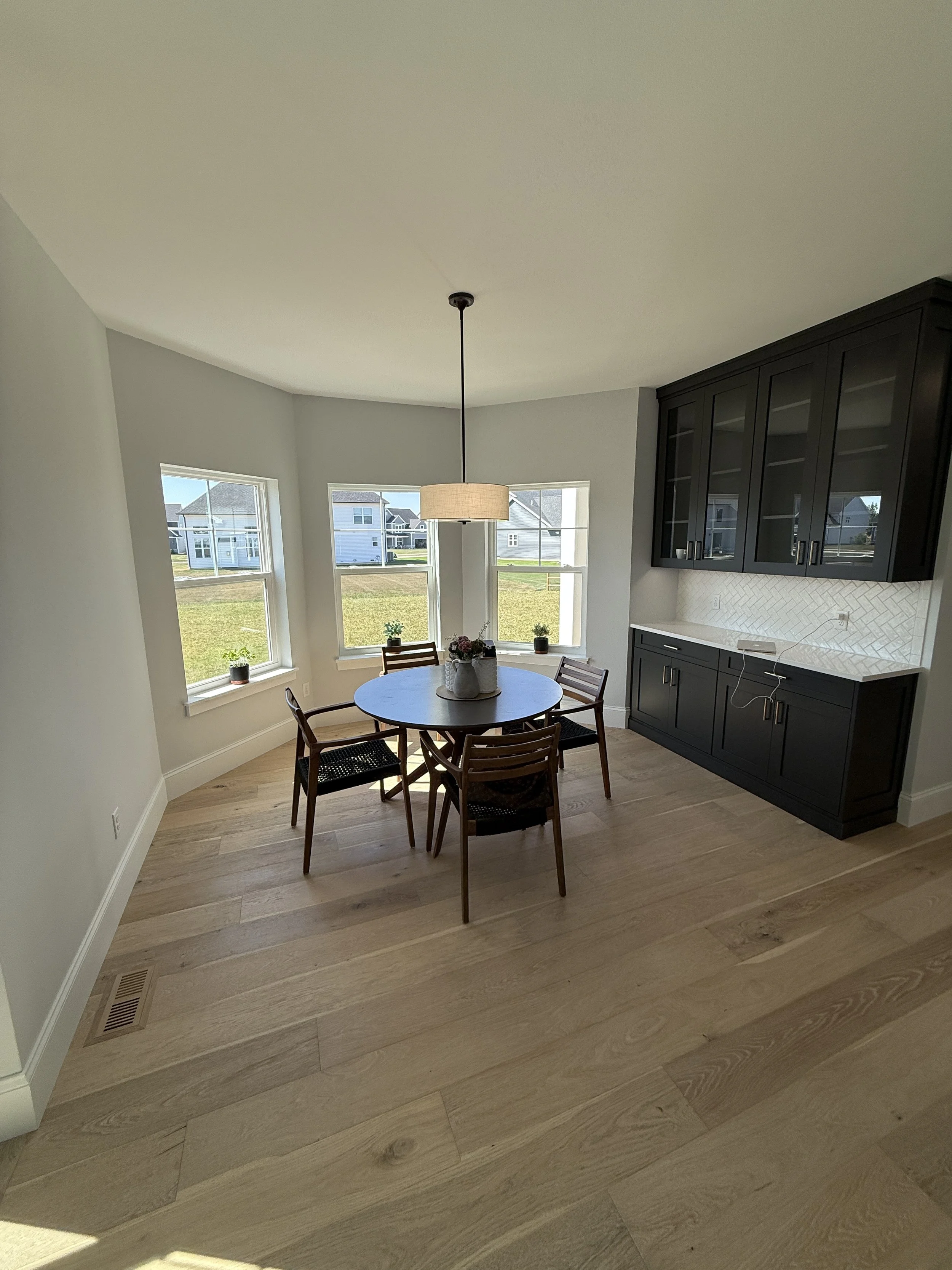 Before virtual redesign of kitchen space with new cabinetry and décor.