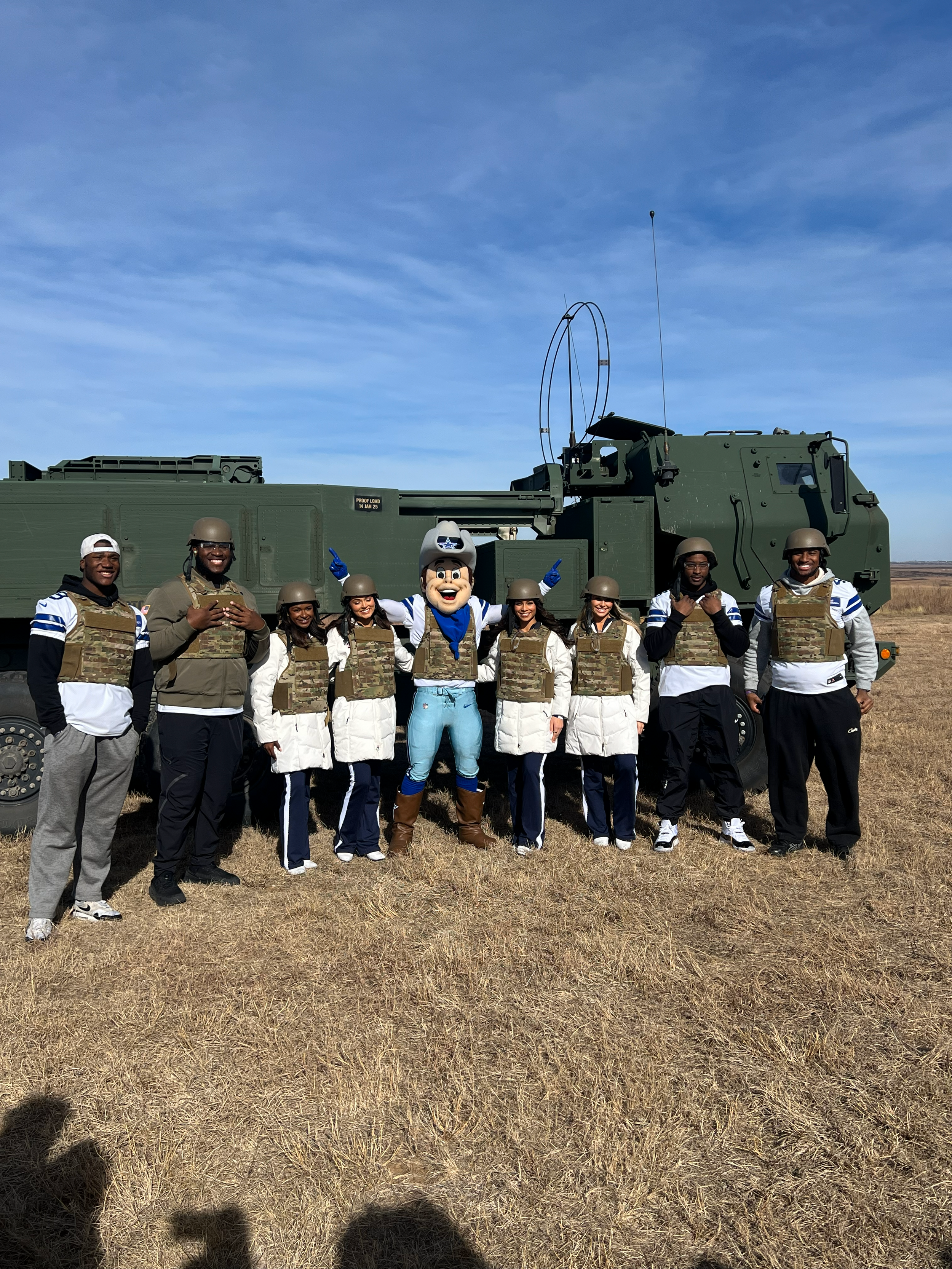 Dallas Cowboys players & cheerleaders visiting a military base