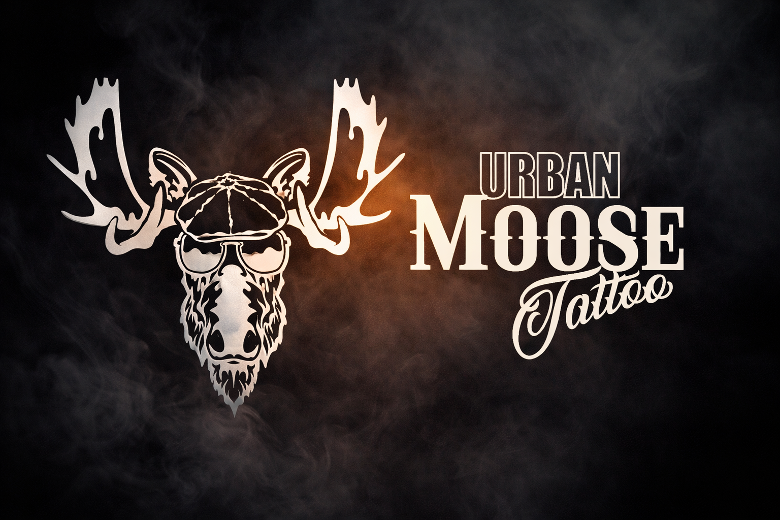 Logo for Urban Moose Tattoo featuring a stylized moose skull with antlers, sunglasses, and a beard, accompanied by the text 'Urban Moose Tattoo'.