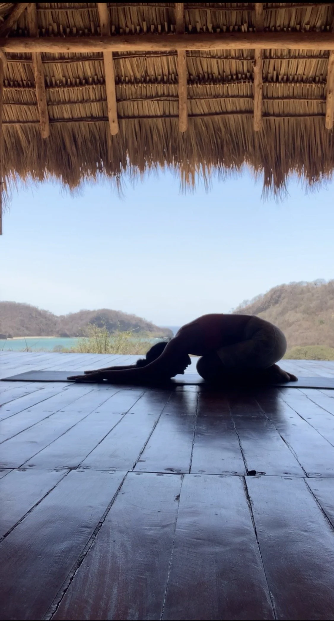 Child's pose in a serene environment for total reset