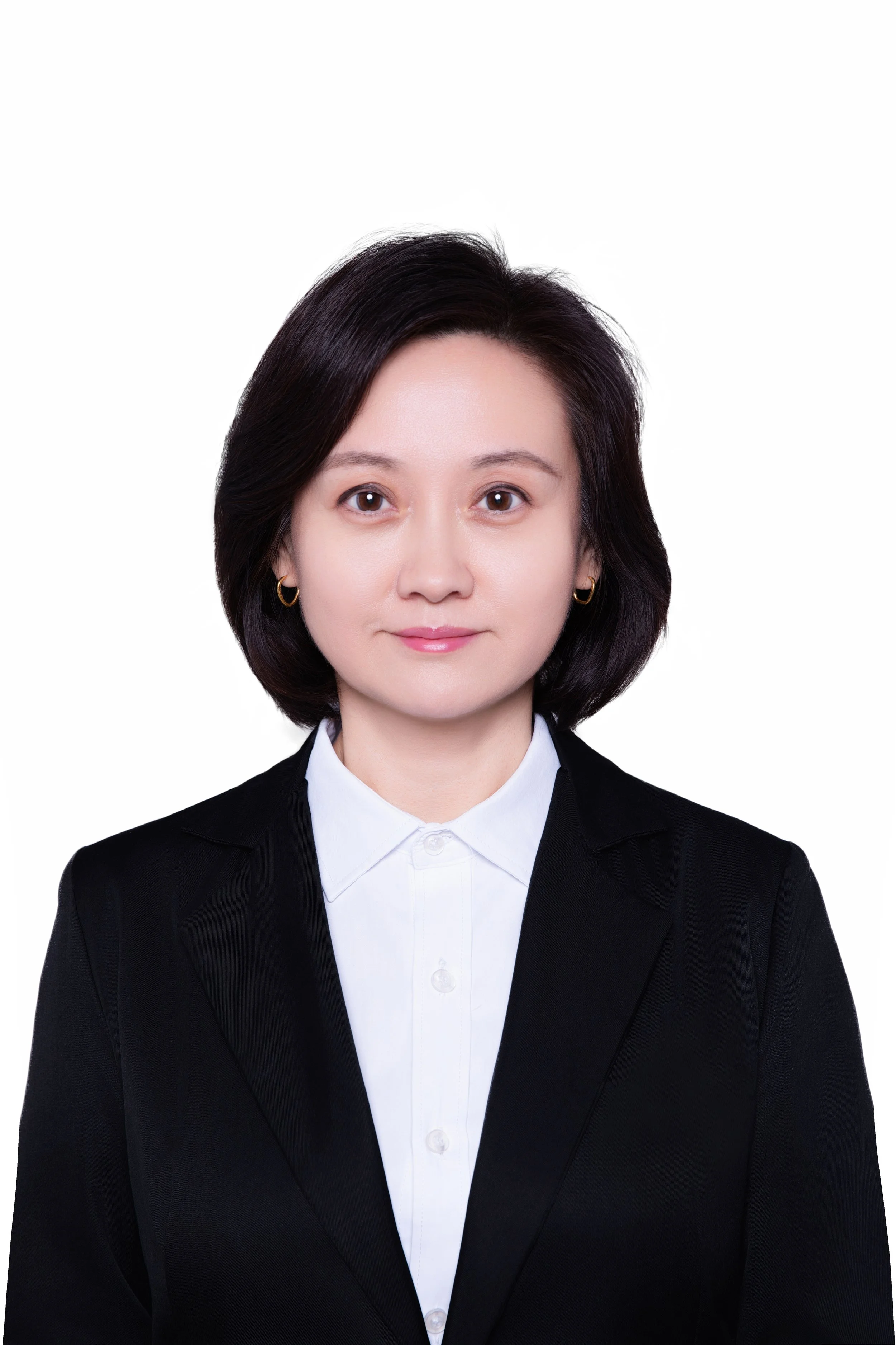 Professional portrait of a woman with short black hair, wearing a black blazer and white shirt, against a plain white background.
