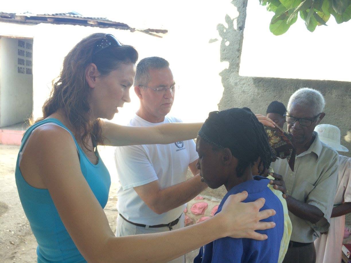 SGGM Praying for Young Woman.jpg