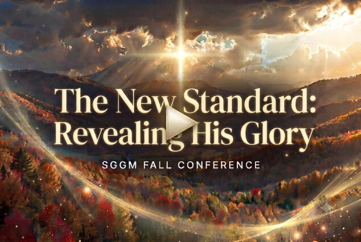 A promotional image for the SGG Fall Conference with a scenic background of mountains and trees in autumn colors, with a glowing sun and shining light effects. The text reads "The New Standard: Revealing His Glory" with a play button icon in the center.