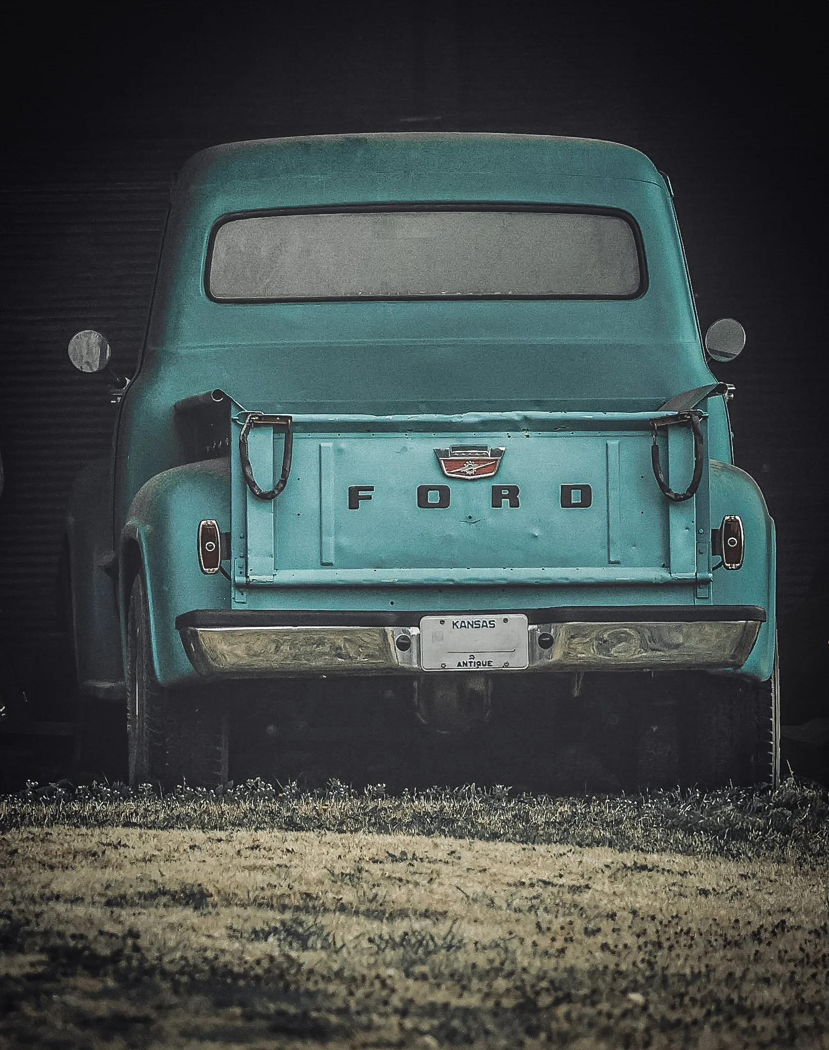 This vintage Ford stands with a quiet strength, its holding on to the charm of another time.