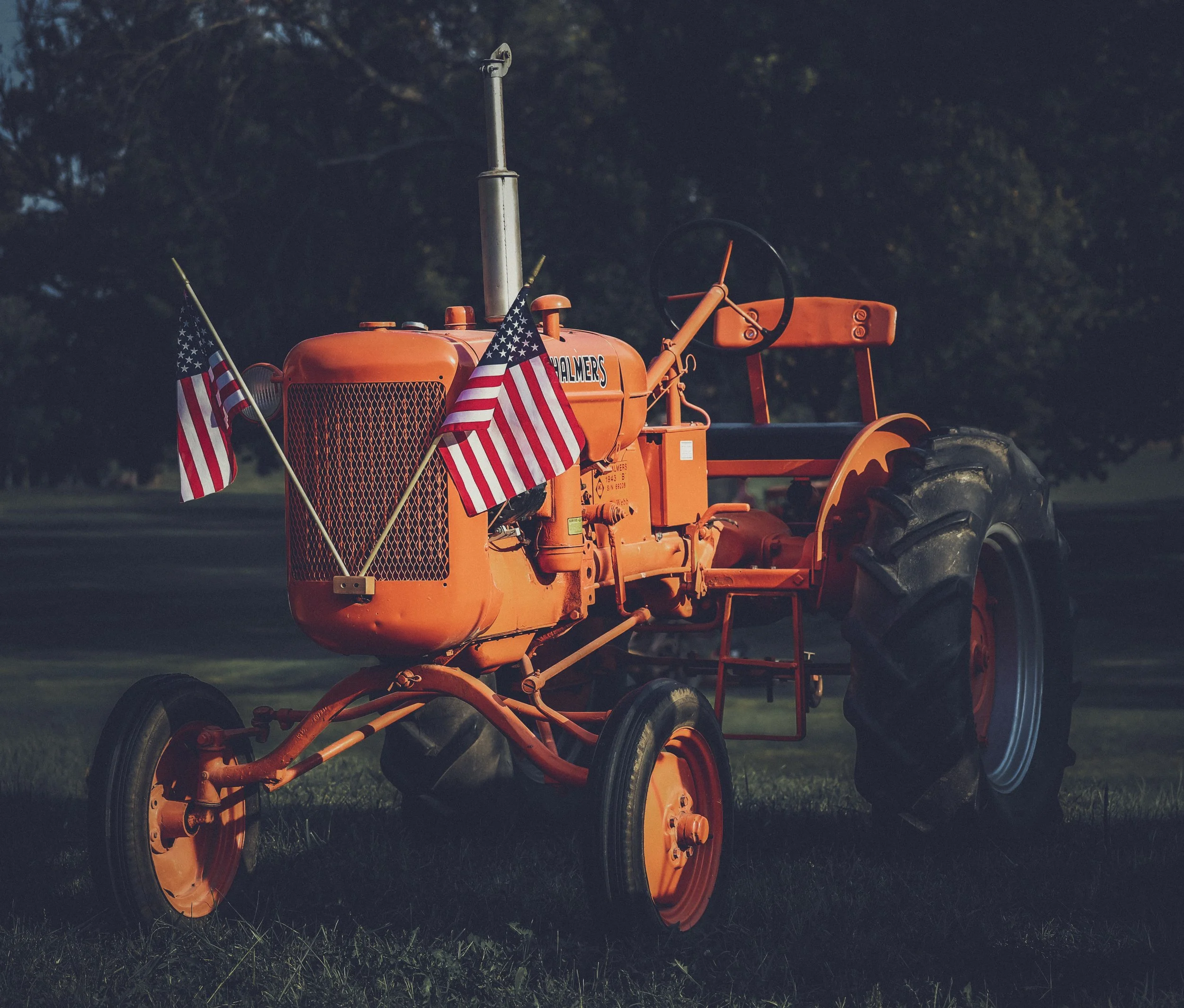 This old Allis-Chalmers stands with a quiet strength, weathered by time and marked by pride.