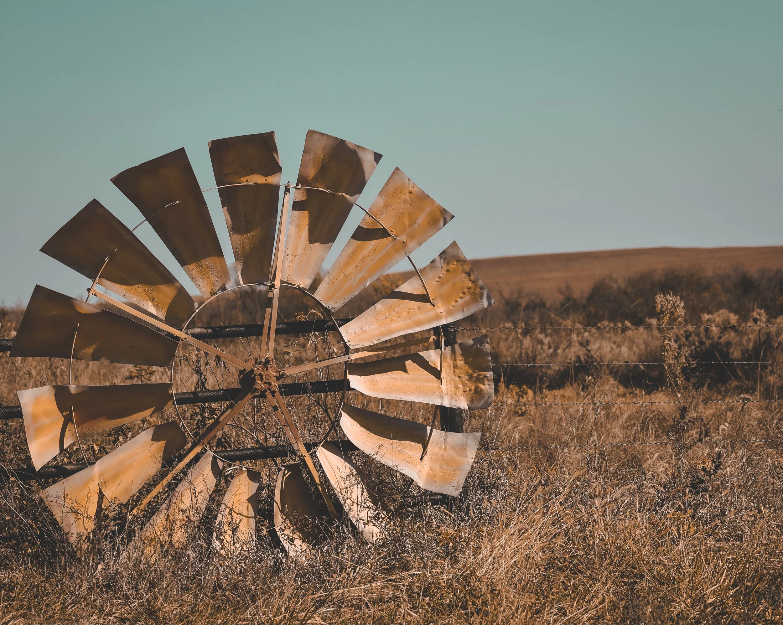 Out in the grass and open sky, this weathered windmill still carries the spirit of the land.