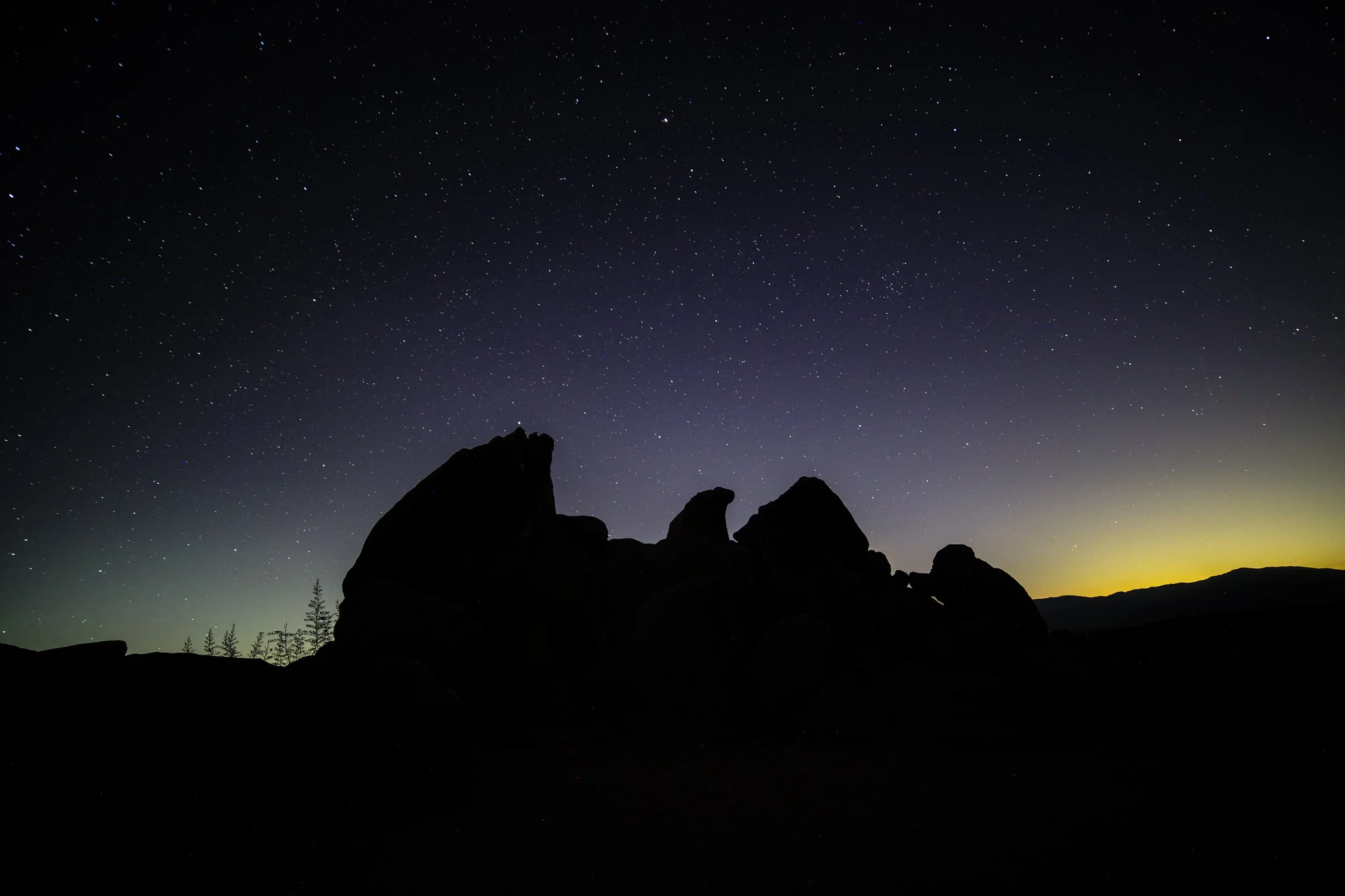 Eagle Rock stood in silhouette beneath a sky full of stars and the last glow of the horizon.