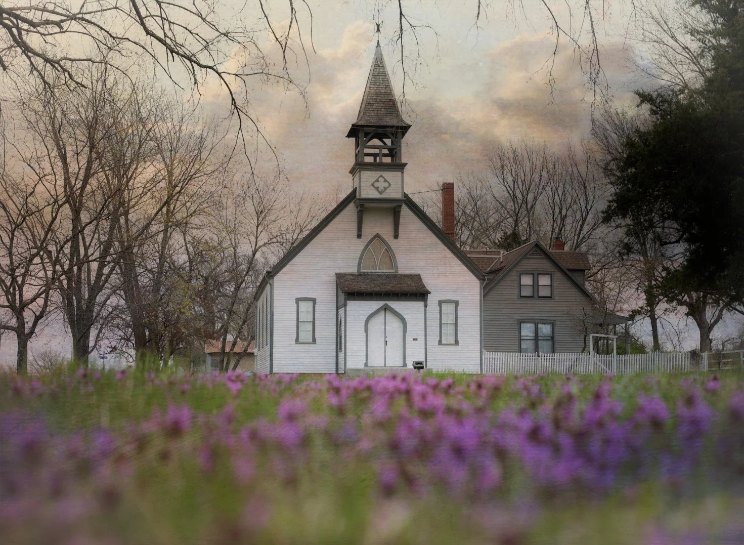White church with purple henbit
