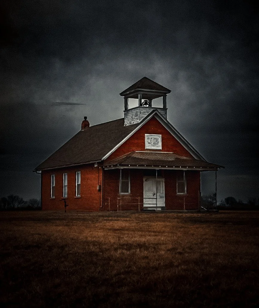 The prairie kept watch while country children filled this schoolhouse with lessons, laughter, and the start of becoming.