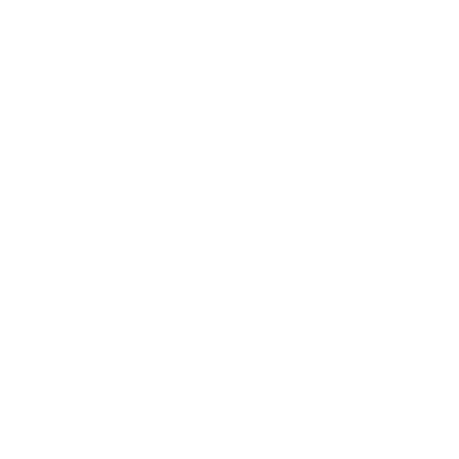 Silhouette of a bed with a round pillow and a small side table.