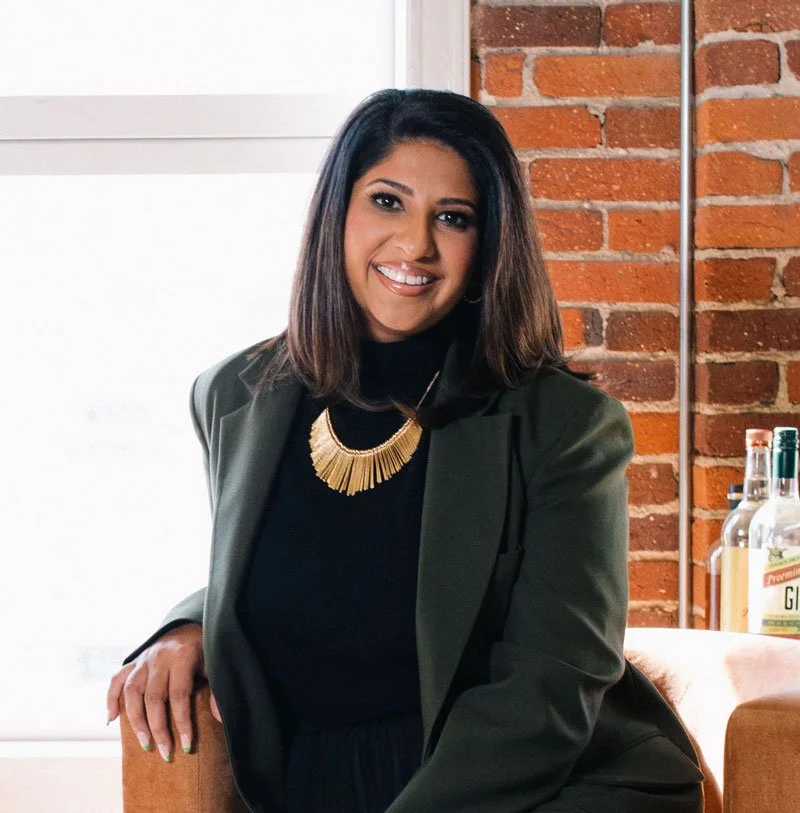 Dr. Payal Beri portrait in front of a brick wall