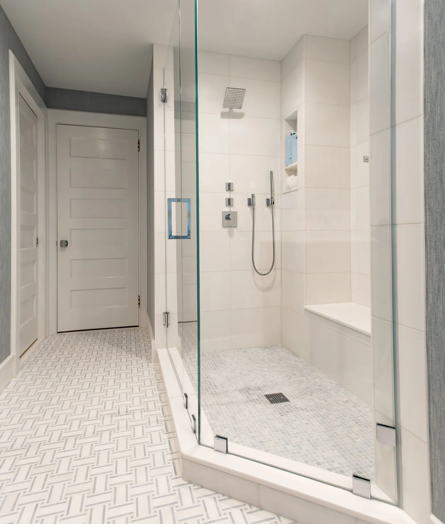 Create a spacious shower with a seat.