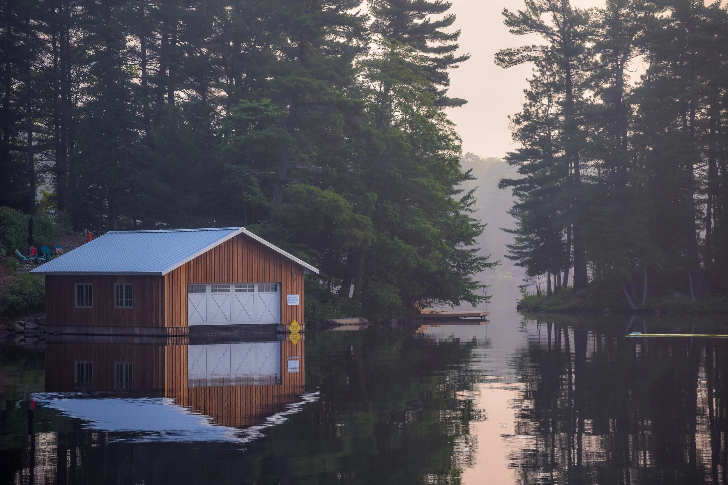Lakefront boat house with cottage on Stoney Lake.