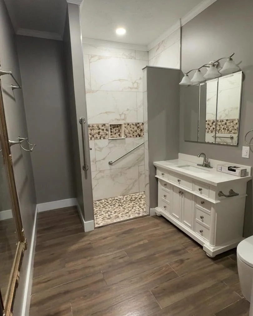 Custom bathroom remodel with walk-in tile shower and double vanity completed in Olive Branch, MS by DeSoto Renovations.