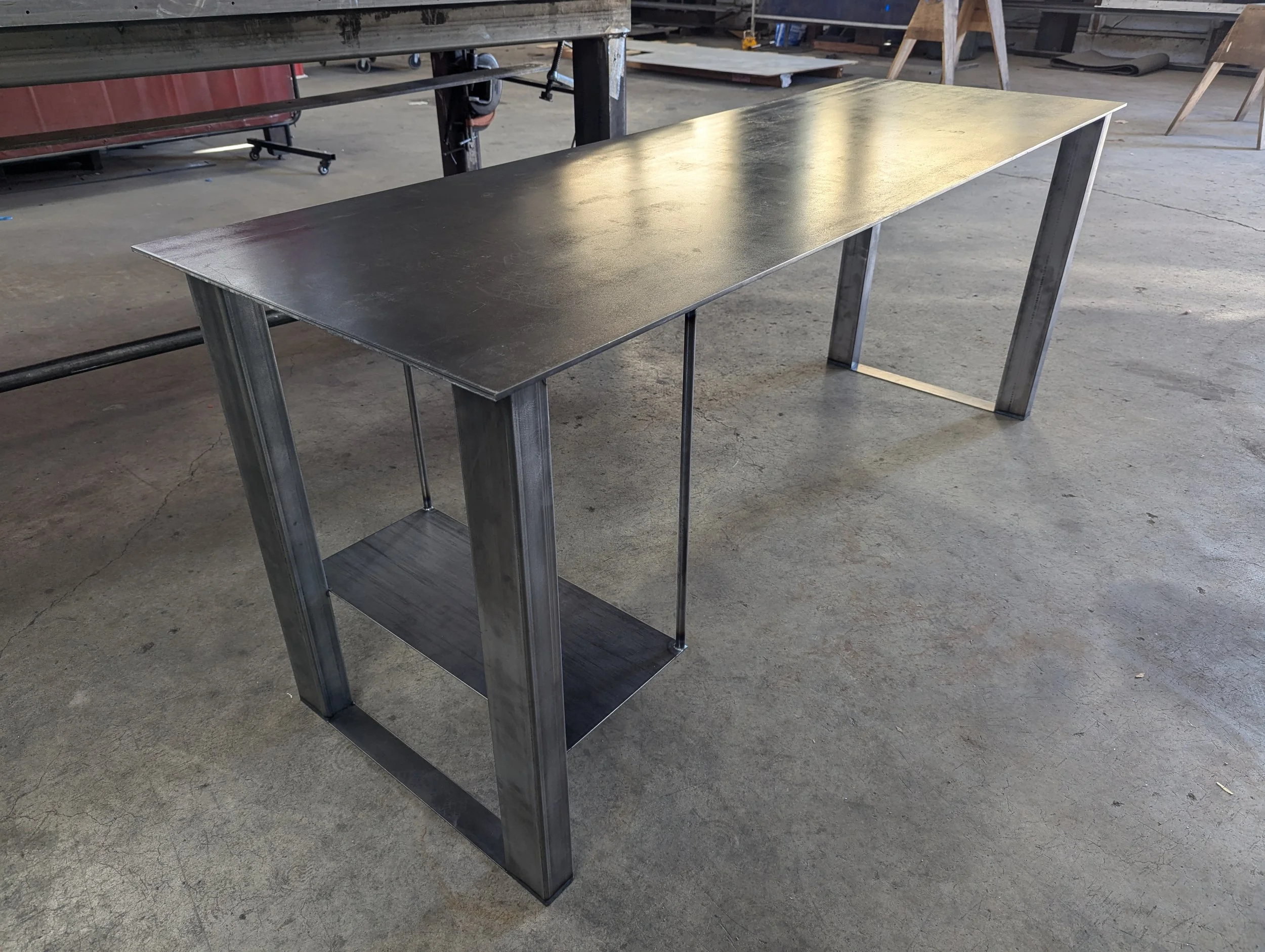 Custom steel desk with a PC shelf. This is just before getting a blackened patina finish. 