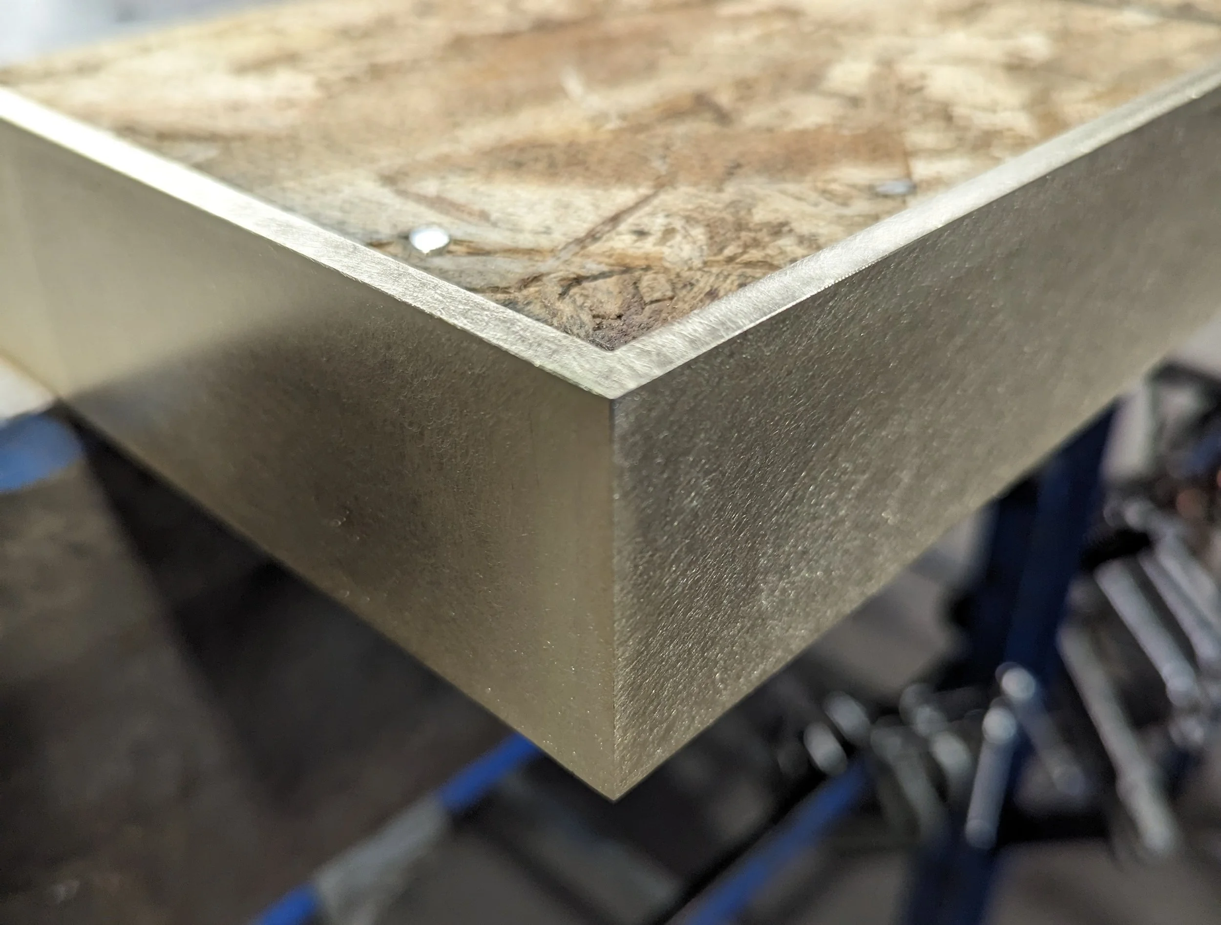 Close-up of a brass corner for a table.
