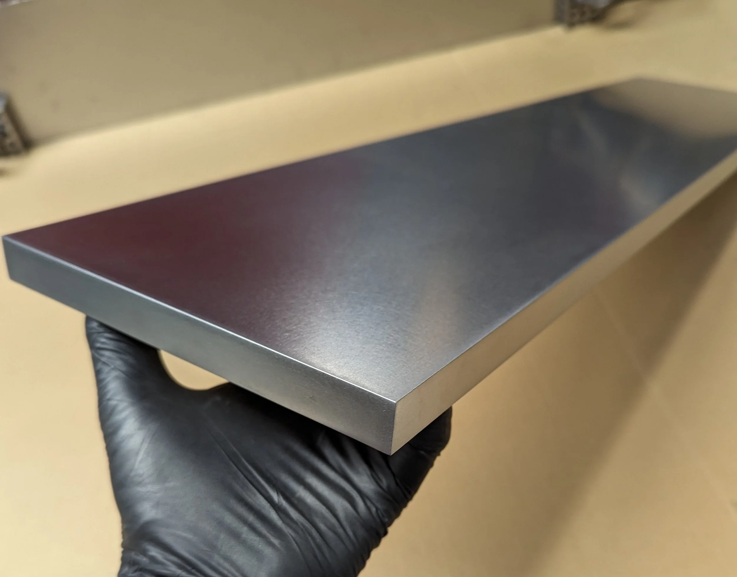 Finished to 120 grit. Mild steel intended for cladding a drawer face.