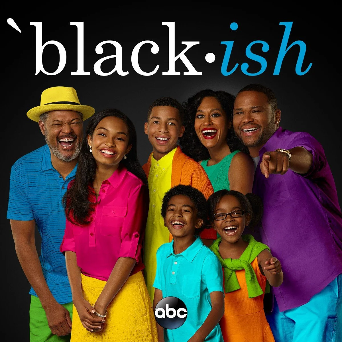 Group of smiling African-American family members wearing colorful clothes, standing against a black background with 'black-ish' text and ABC logo.