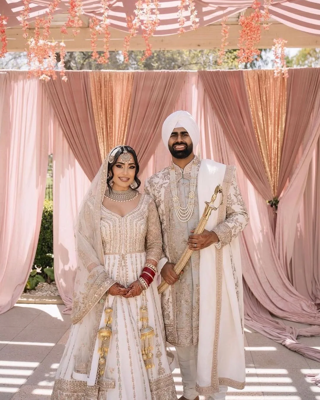 Laurie’s customers, Fernando and Kate embracing by the lake on their wedding day.