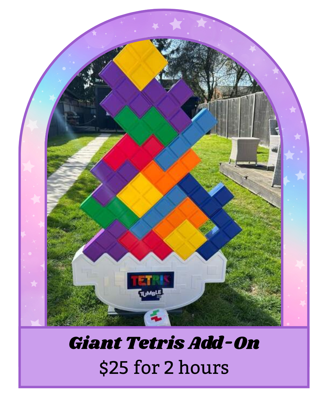 A large, colorful Tetris-shaped block structure on a white base with the Tetris and Tumble logos, displayed outdoors on grass with a fence and trees in the background, promoting a giant Tetris add-on for $25 for two hours.