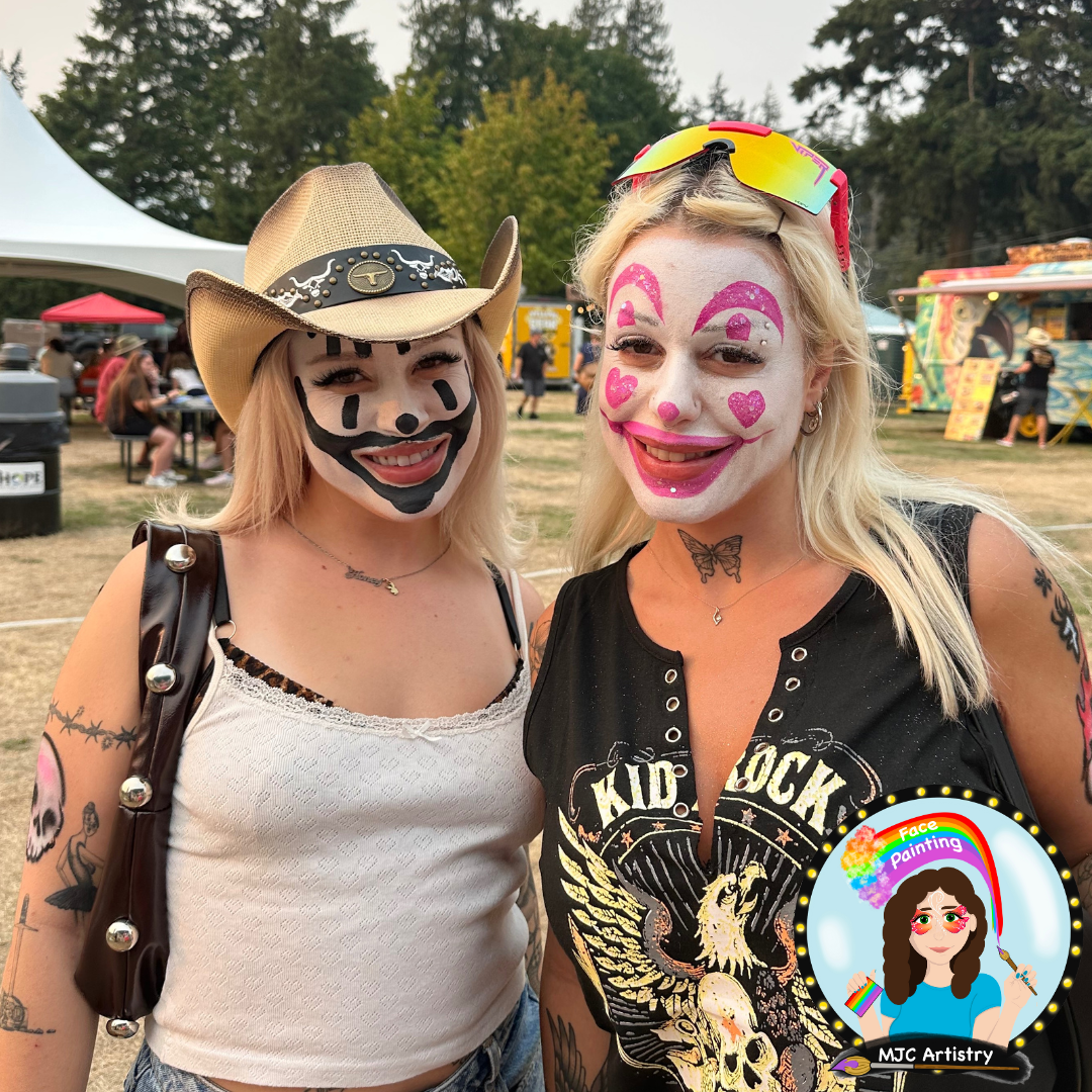 Two women at a festival with face painting, both wearing clown-style face paint, at a festival in Vancouver.
