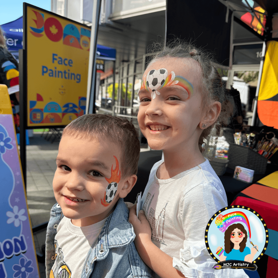 two-kids-soccer-ball-rainbow-face-painting-mjc-artistry-sign-cbc-fifa-world-cup-vancouver.png