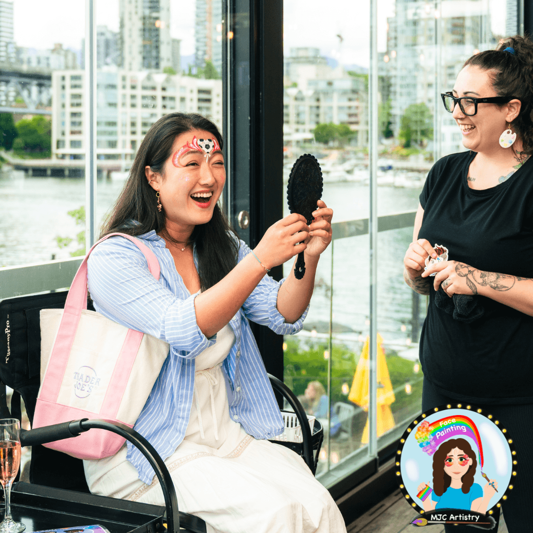 mjc-artistry-face-painter-client-reaction-mirror-corporate-fifa-event-granville-island-vancouver.png