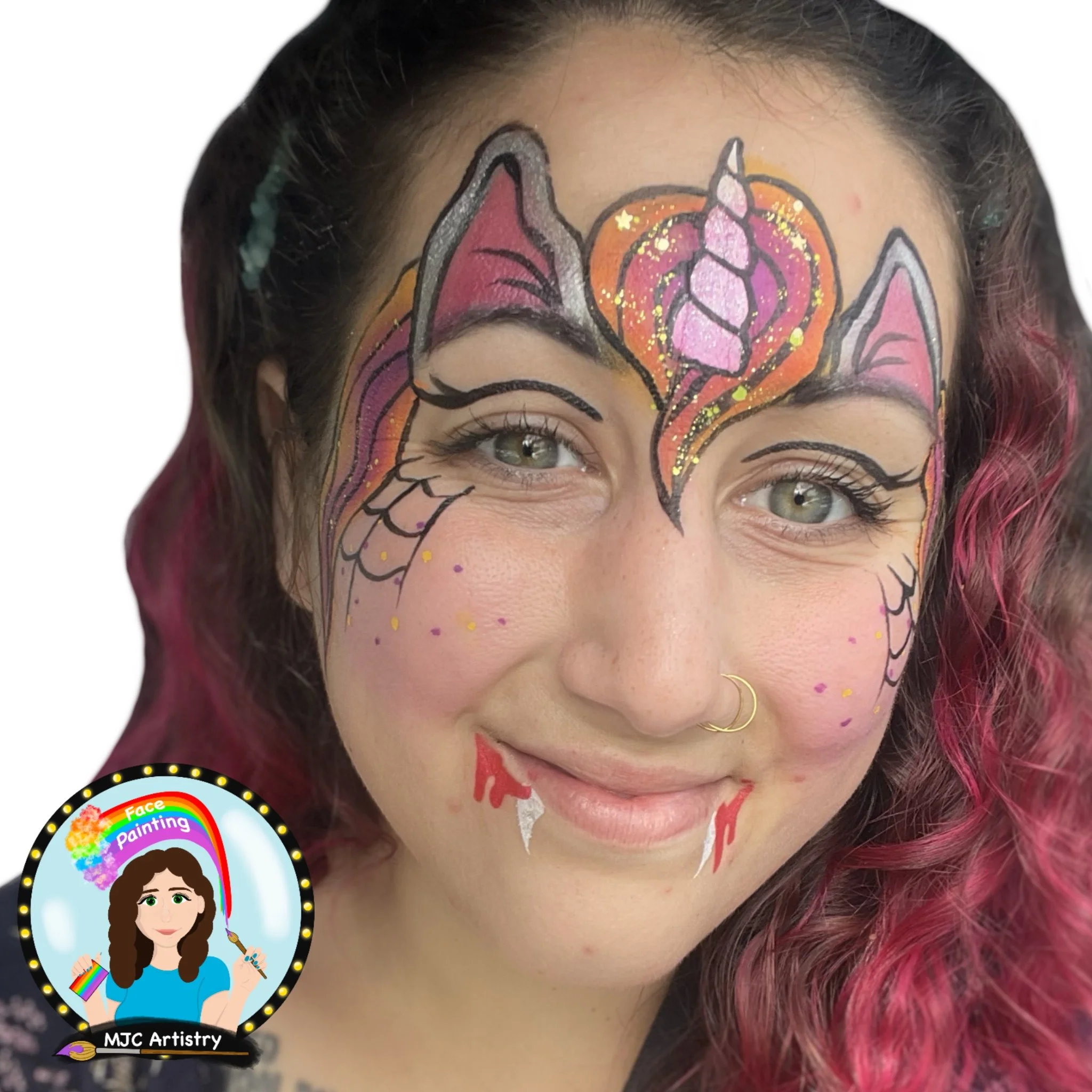 Woman with face painted as a colorful unicorn, featuring pink, purple, yellow, and orange hues, with sparkling accents and a playful design.