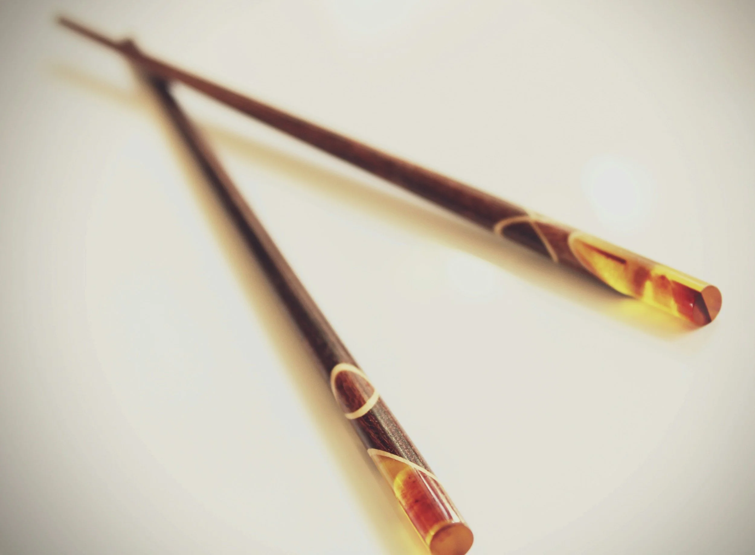 brown chopsticks with paint