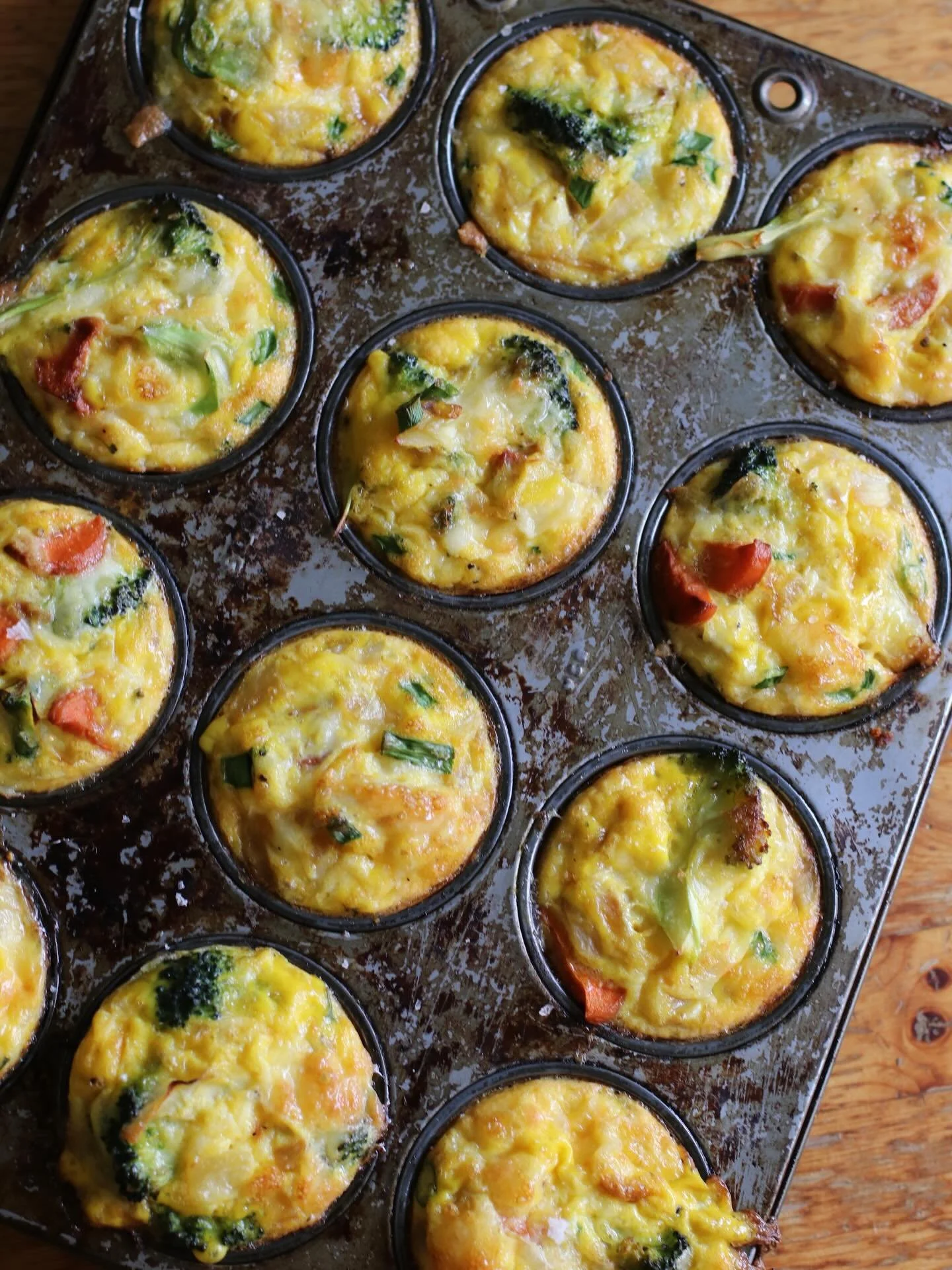 A tray of egg bites cooling on the counter might be one of the most underrated luxuries. 🍳

Roasted potatoes, broccoli, green onion, melty cheese &mdash; all tucked into little handheld breakfasts.

High-protein. Veg-loaded. Grab-and-go! The kind of