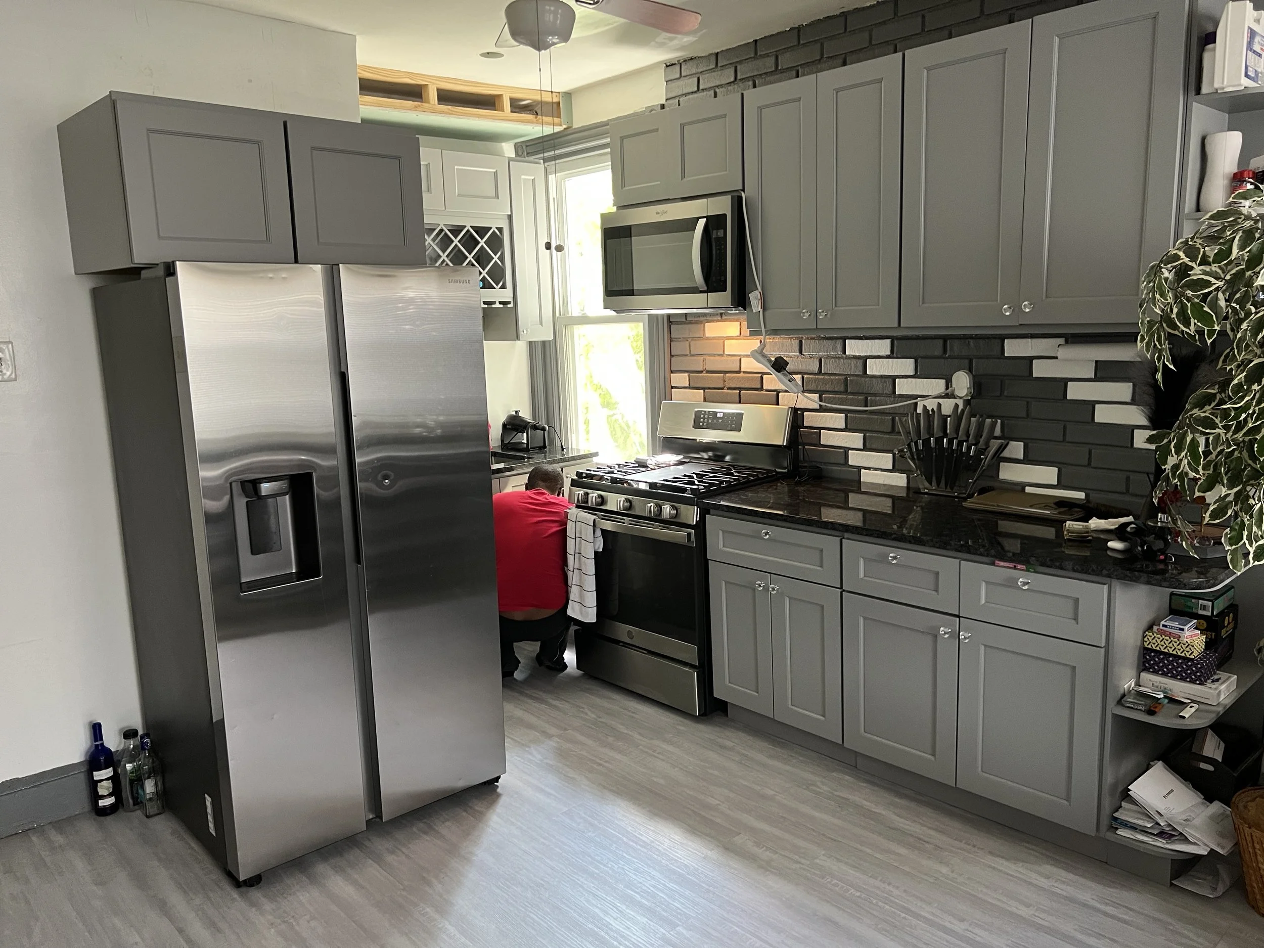 Kitchen remodel cabinets stainless steel appliances LVP flooring