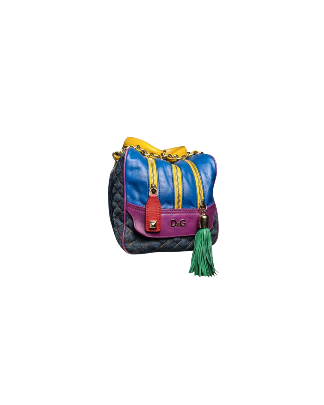 Colorful designer handbag with yellow zippers, pink and blue panels, green tassel, and chain strap.